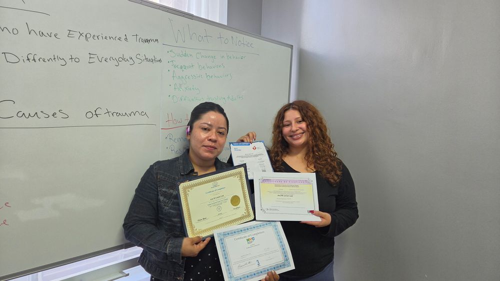 Graduates with their certificates of completion